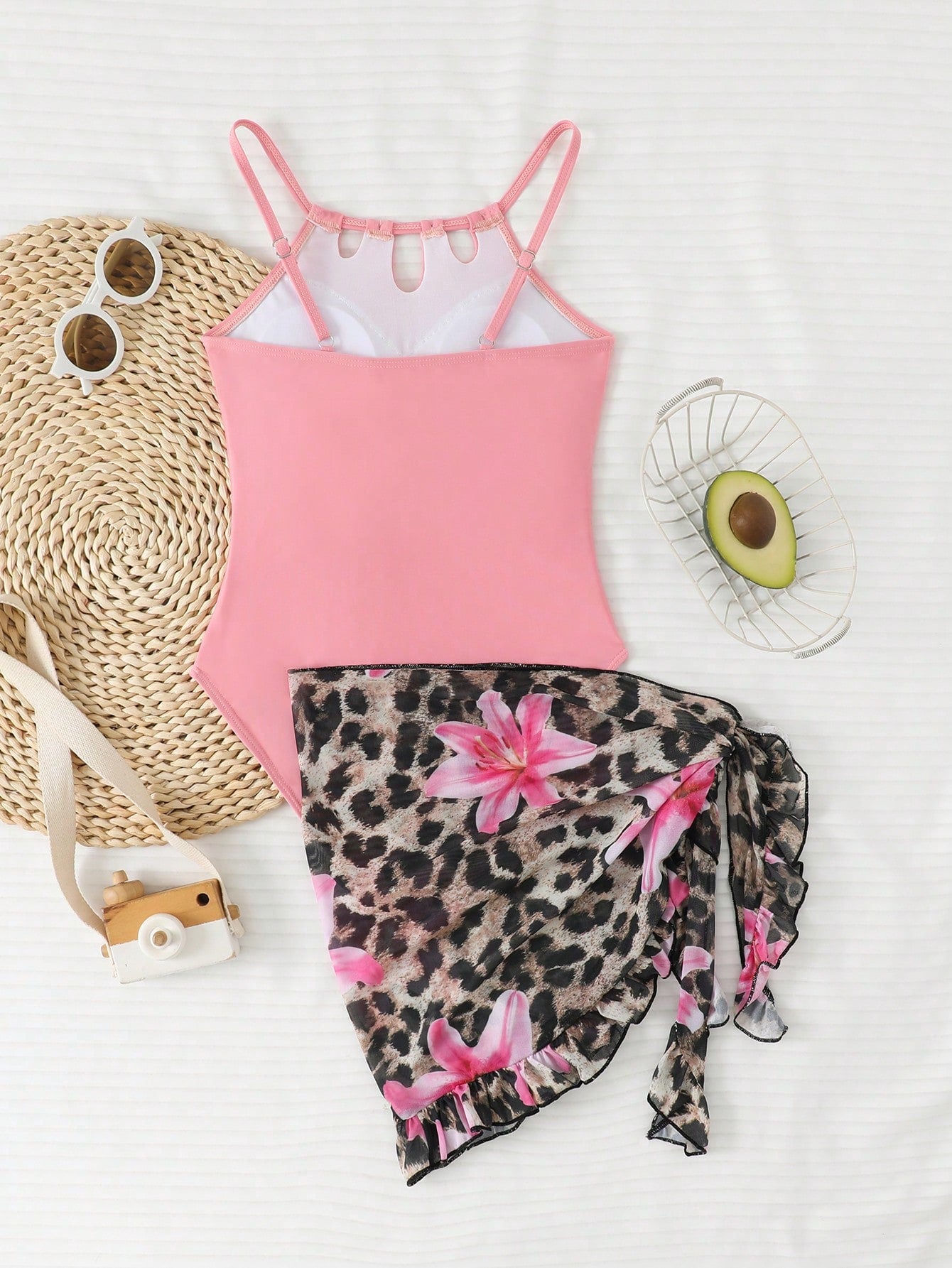 Girls black and white one-piece swimsuit set with cut-out detail, spaghetti straps, sleeveless fitted design, and matching skirt bottom for vacation swimwear.