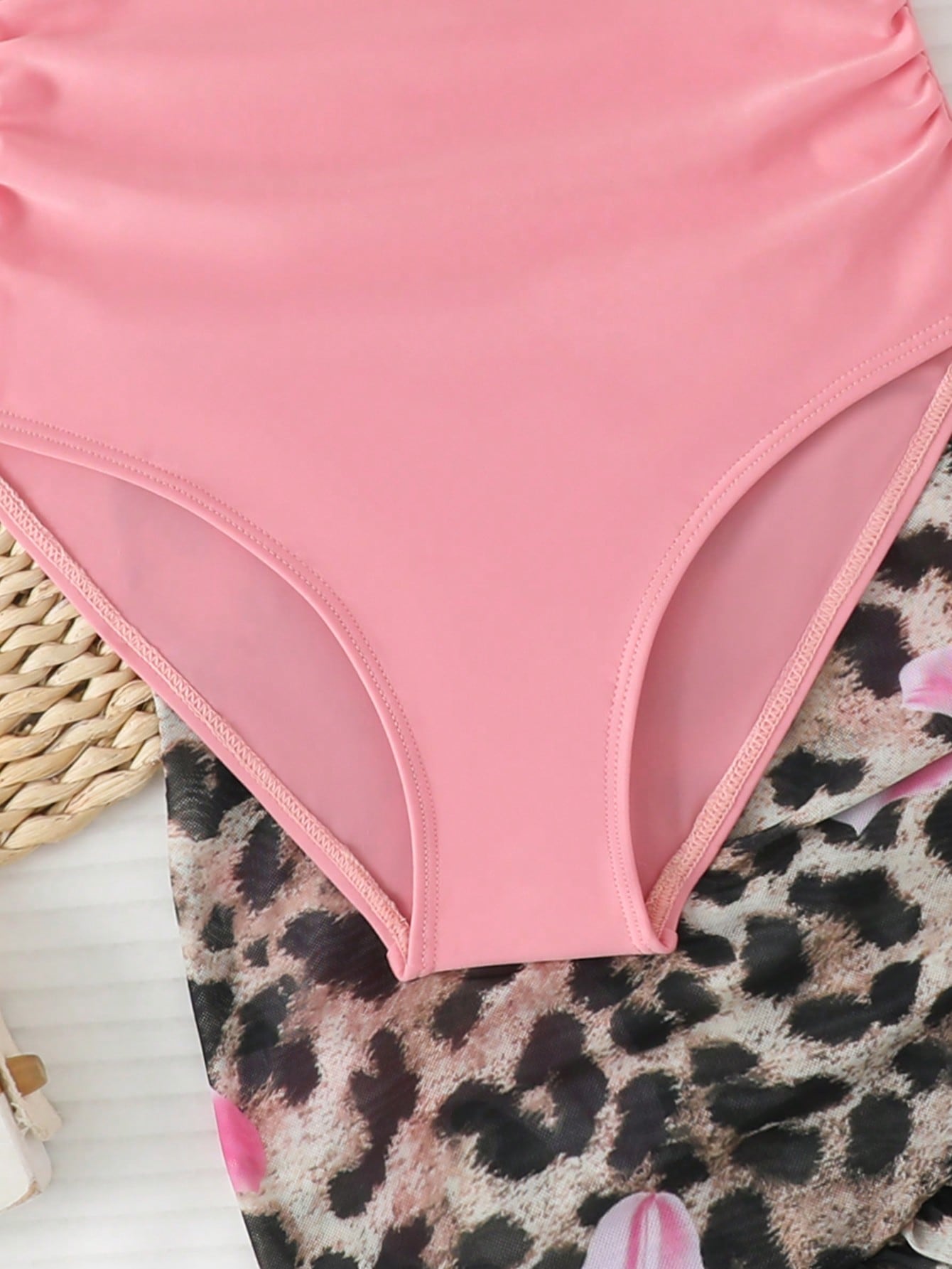 Girls black and white one-piece swimsuit set with cut-out detail, spaghetti straps, sleeveless fitted design, and matching skirt bottom for vacation swimwear.