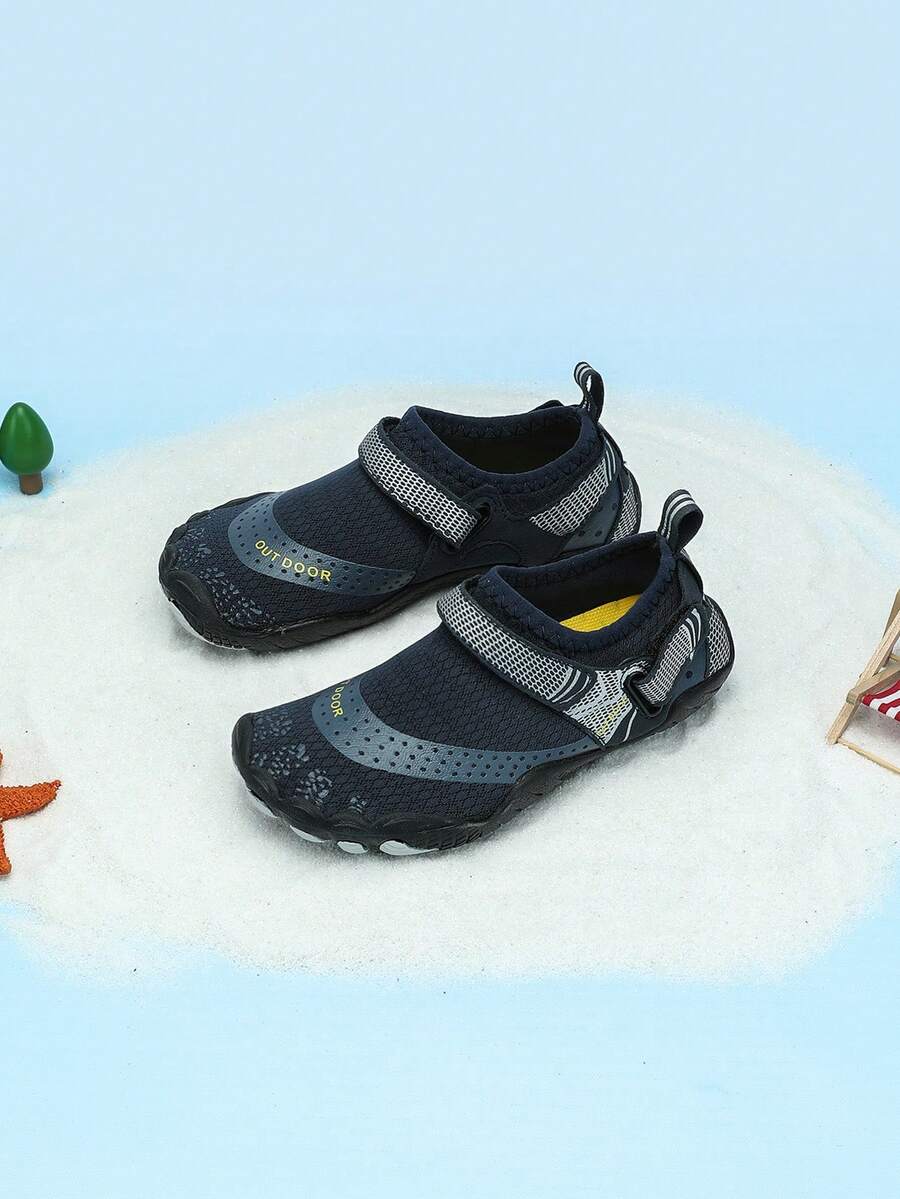 Boys grey breathable fabric water shoes featuring hook and loop closure and durable rubber sole.