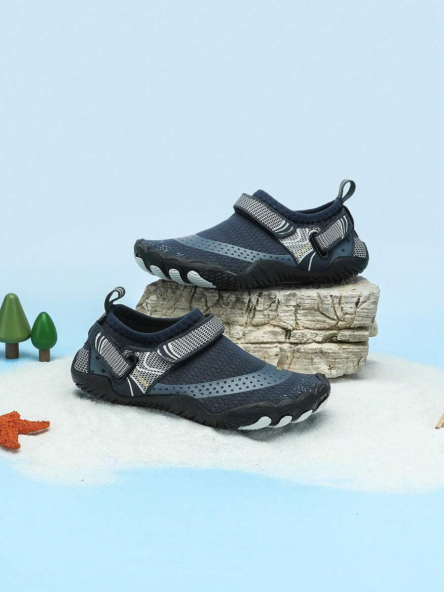 Boys grey breathable fabric water shoes featuring hook and loop closure and durable rubber sole.
