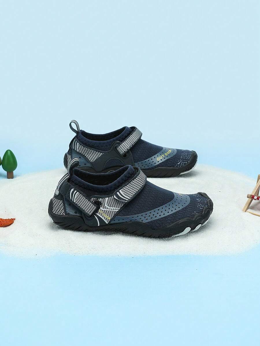 Boys grey breathable fabric water shoes featuring hook and loop closure and durable rubber sole.