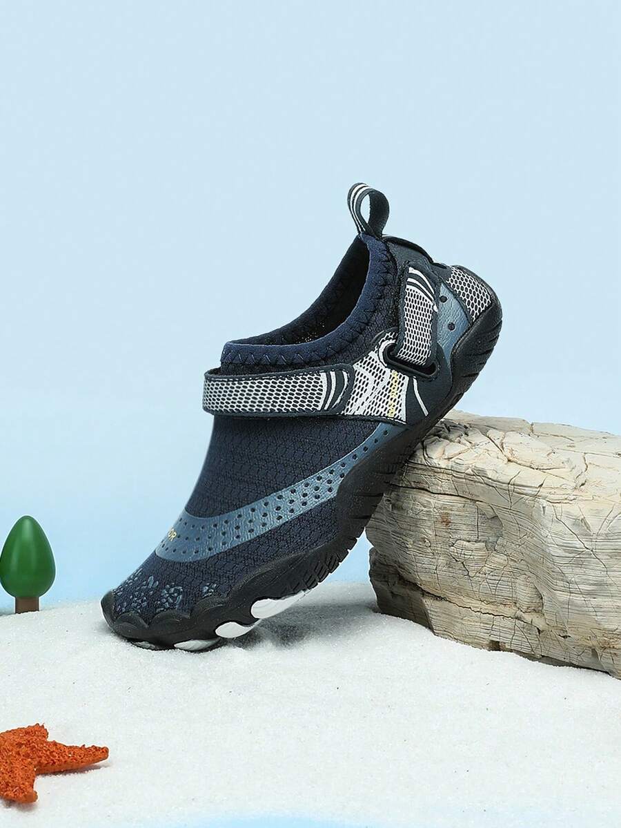 Boys grey breathable fabric water shoes featuring hook and loop closure and durable rubber sole.