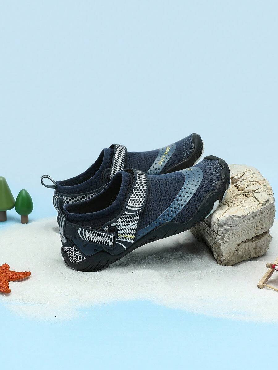 Boys grey breathable fabric water shoes featuring hook and loop closure and durable rubber sole.