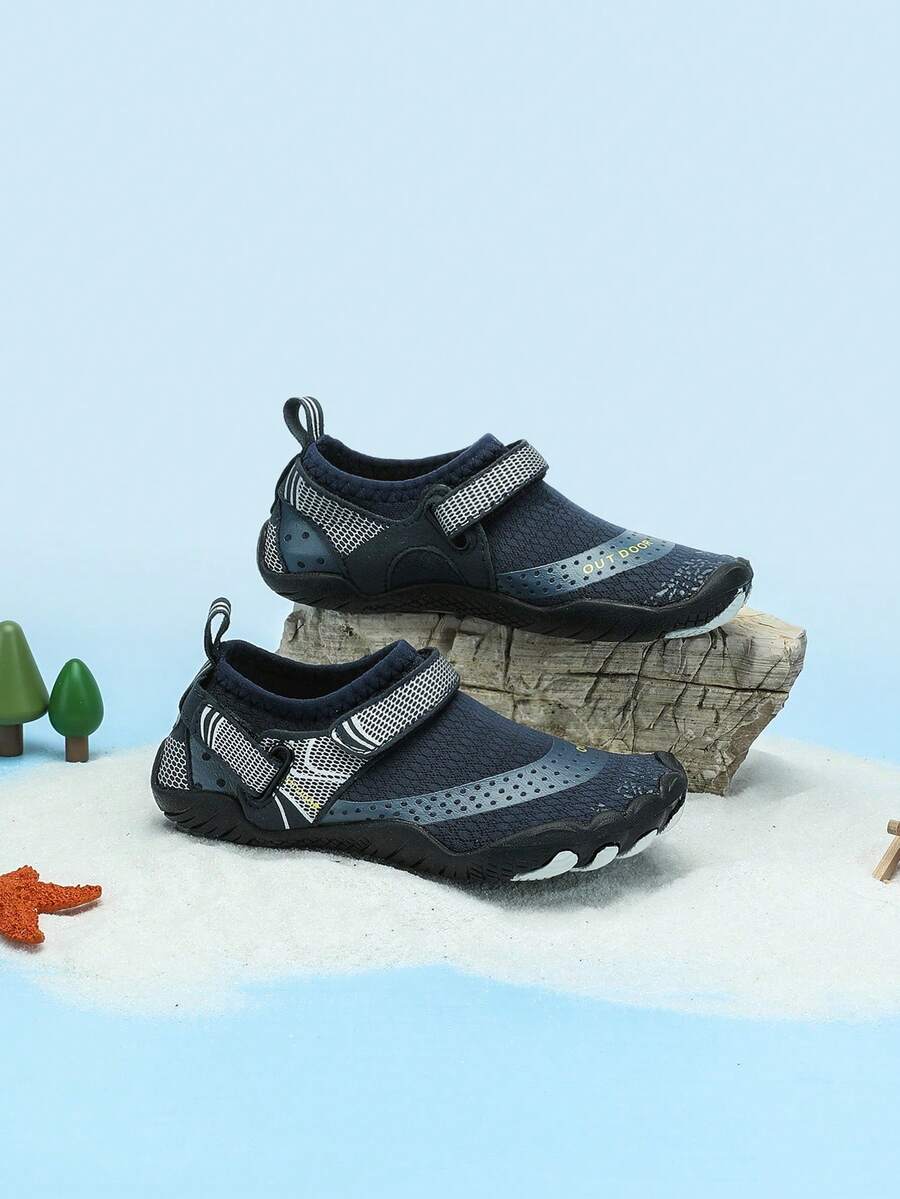 Boys grey breathable fabric water shoes featuring hook and loop closure and durable rubber sole.