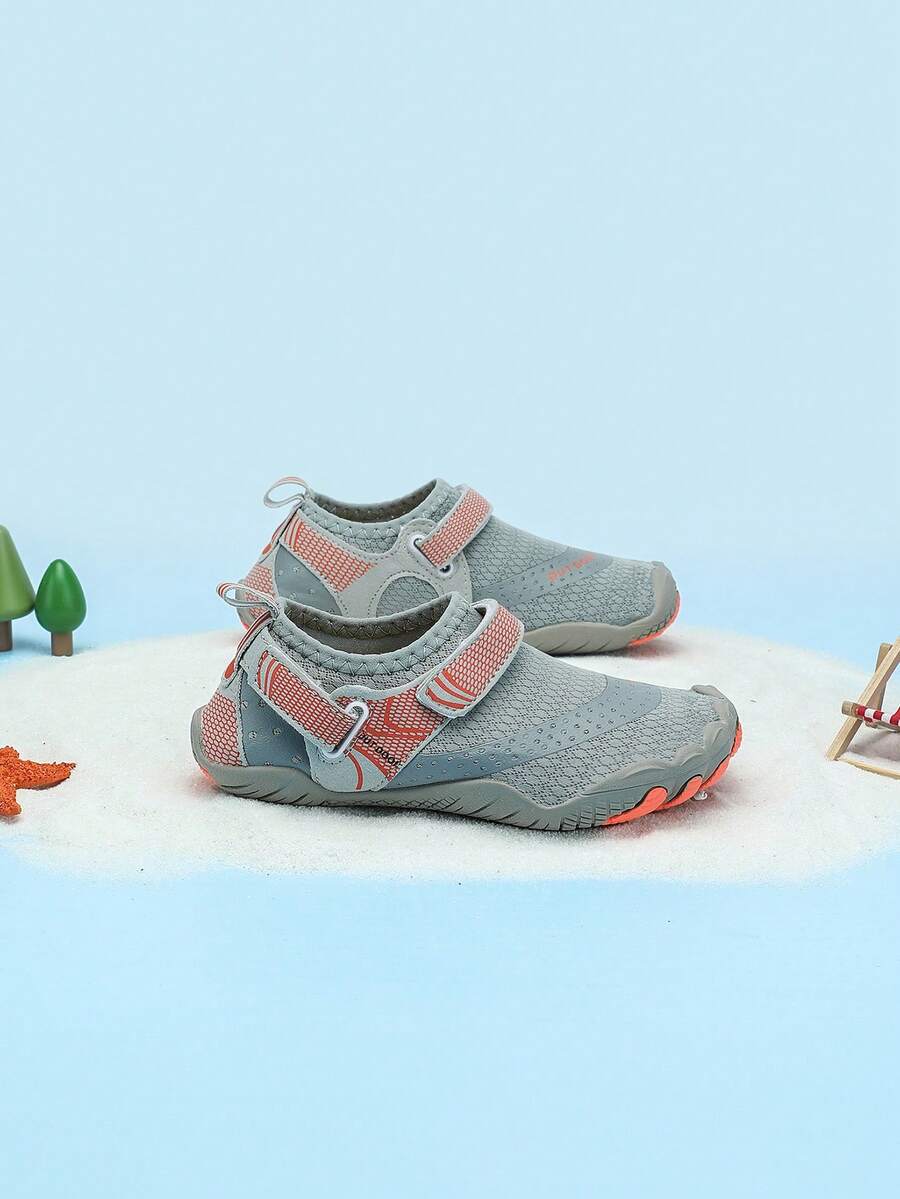 Boys grey breathable fabric water shoes featuring hook and loop closure and durable rubber sole.