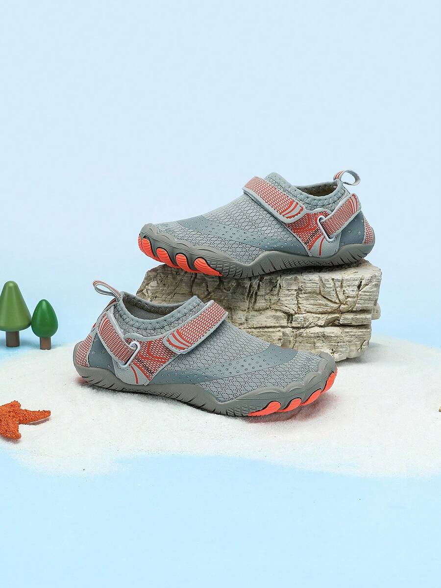 Boys grey breathable fabric water shoes featuring hook and loop closure and durable rubber sole.