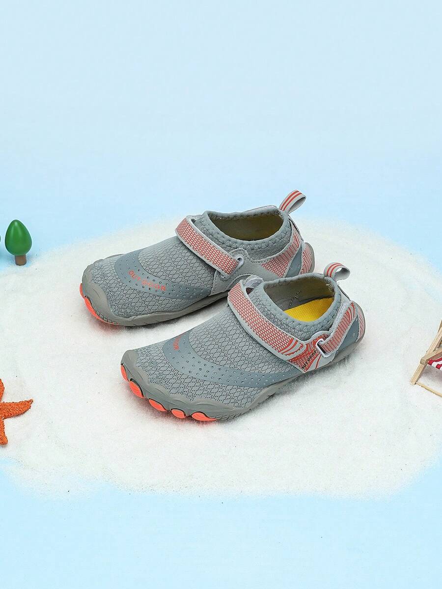 Boys grey breathable fabric water shoes featuring hook and loop closure and durable rubber sole.