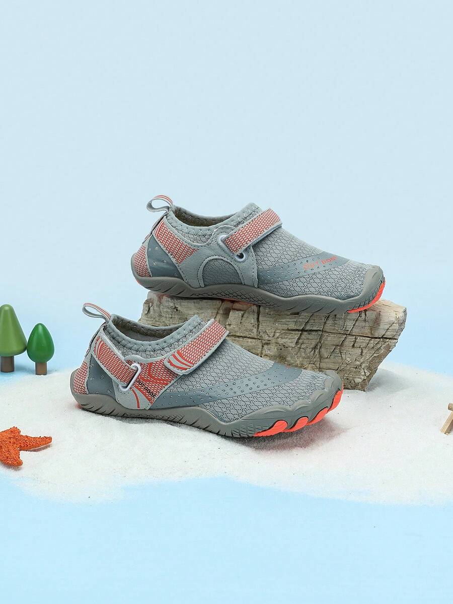 Boys grey breathable fabric water shoes featuring hook and loop closure and durable rubber sole.