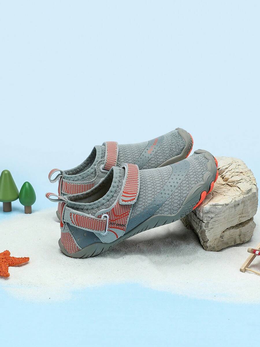 Boys grey breathable fabric water shoes featuring hook and loop closure and durable rubber sole.