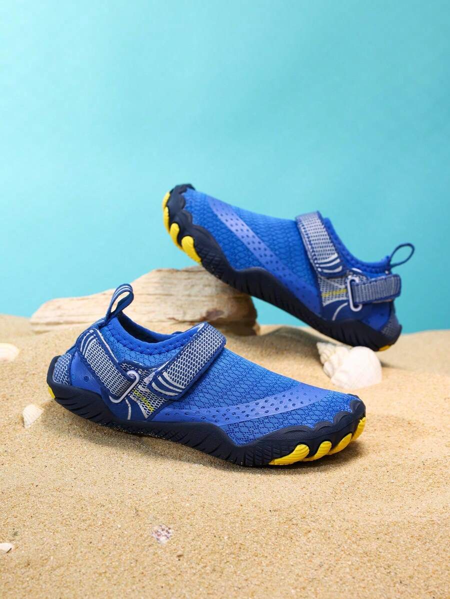 Boys grey breathable fabric water shoes featuring hook and loop closure and durable rubber sole.