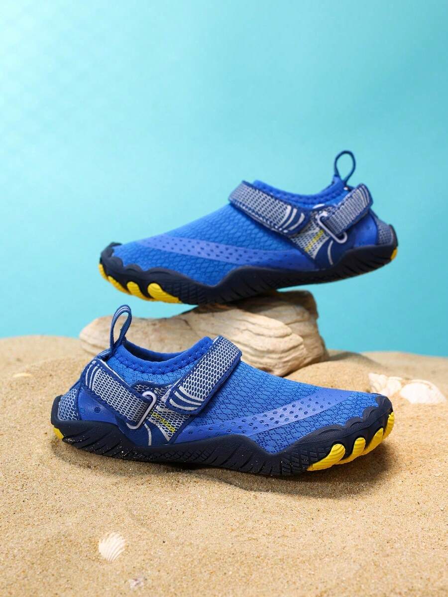 Boys grey breathable fabric water shoes featuring hook and loop closure and durable rubber sole.