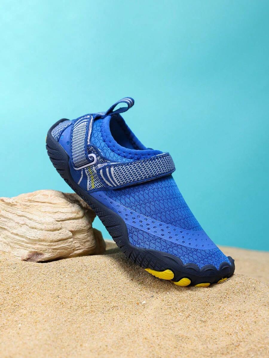 Boys grey breathable fabric water shoes featuring hook and loop closure and durable rubber sole.