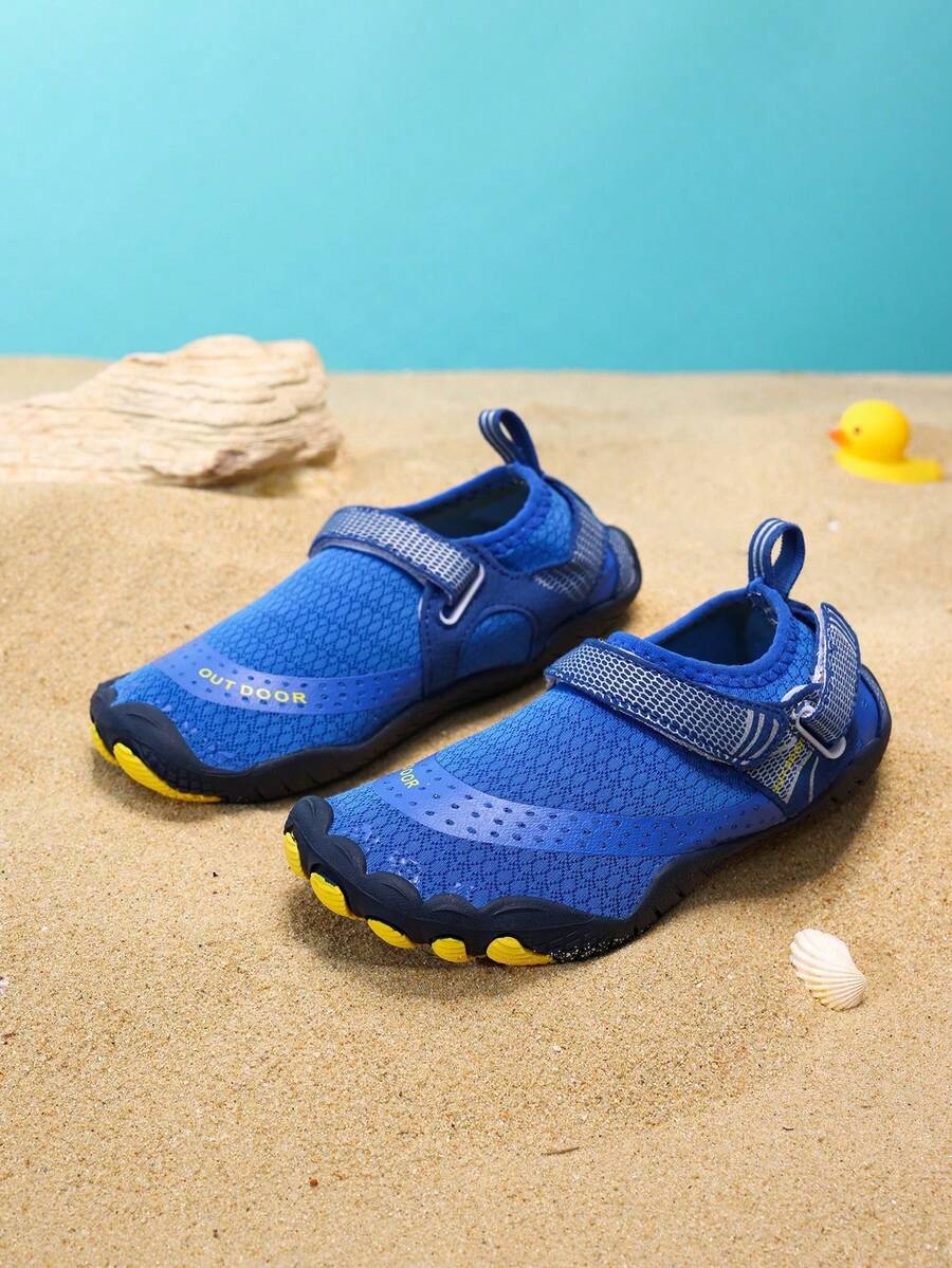 Boys grey breathable fabric water shoes featuring hook and loop closure and durable rubber sole.