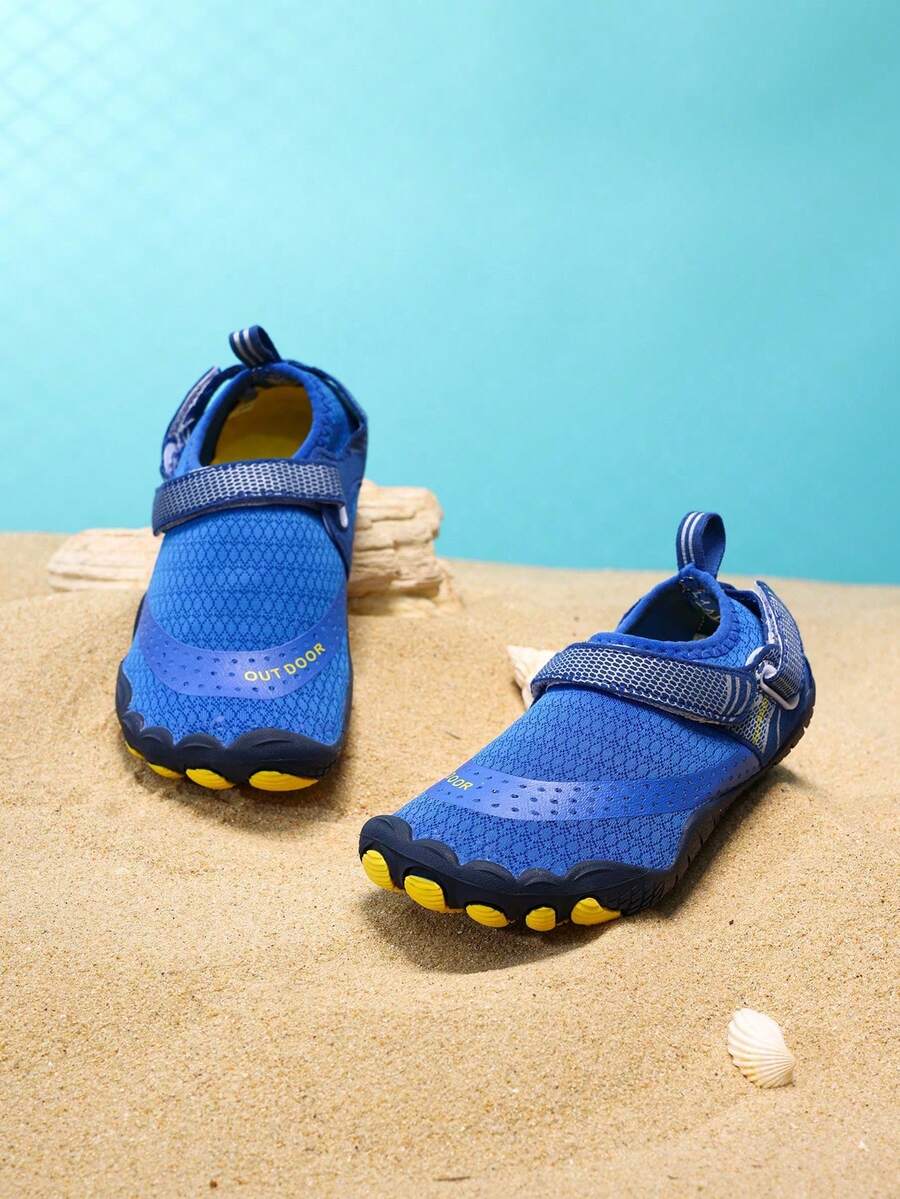 Boys grey breathable fabric water shoes featuring hook and loop closure and durable rubber sole.