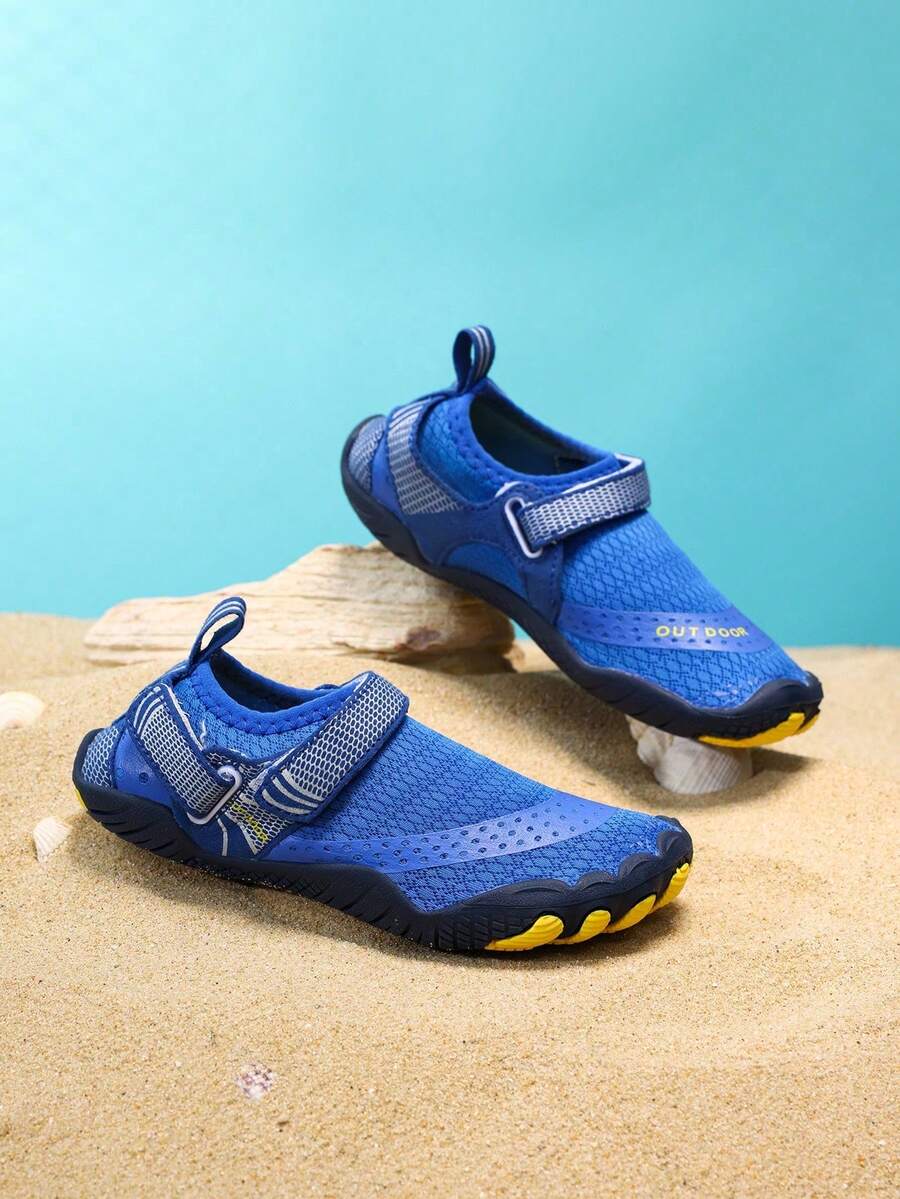 Boys grey breathable fabric water shoes featuring hook and loop closure and durable rubber sole.