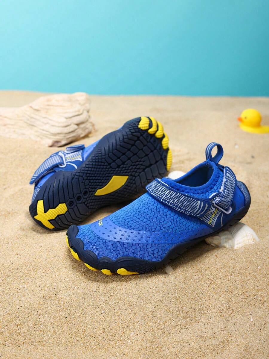 Boys grey breathable fabric water shoes featuring hook and loop closure and durable rubber sole.