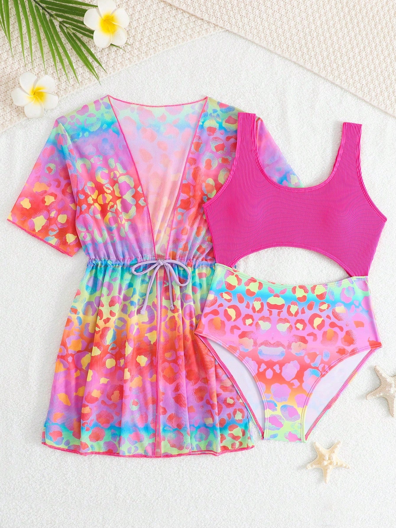 Tween girls multicolor 2-piece swimsuit set with scoop neck, cut-out details, patterned design, shorts-style bottoms, and sheer UV protection cover-up for beach and pool vacations.