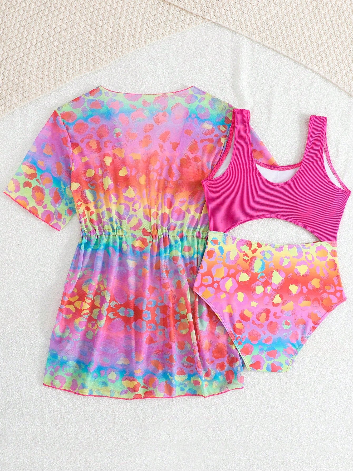 Tween girls multicolor 2-piece swimsuit set with scoop neck, cut-out details, patterned design, shorts-style bottoms, and sheer UV protection cover-up for beach and pool vacations.