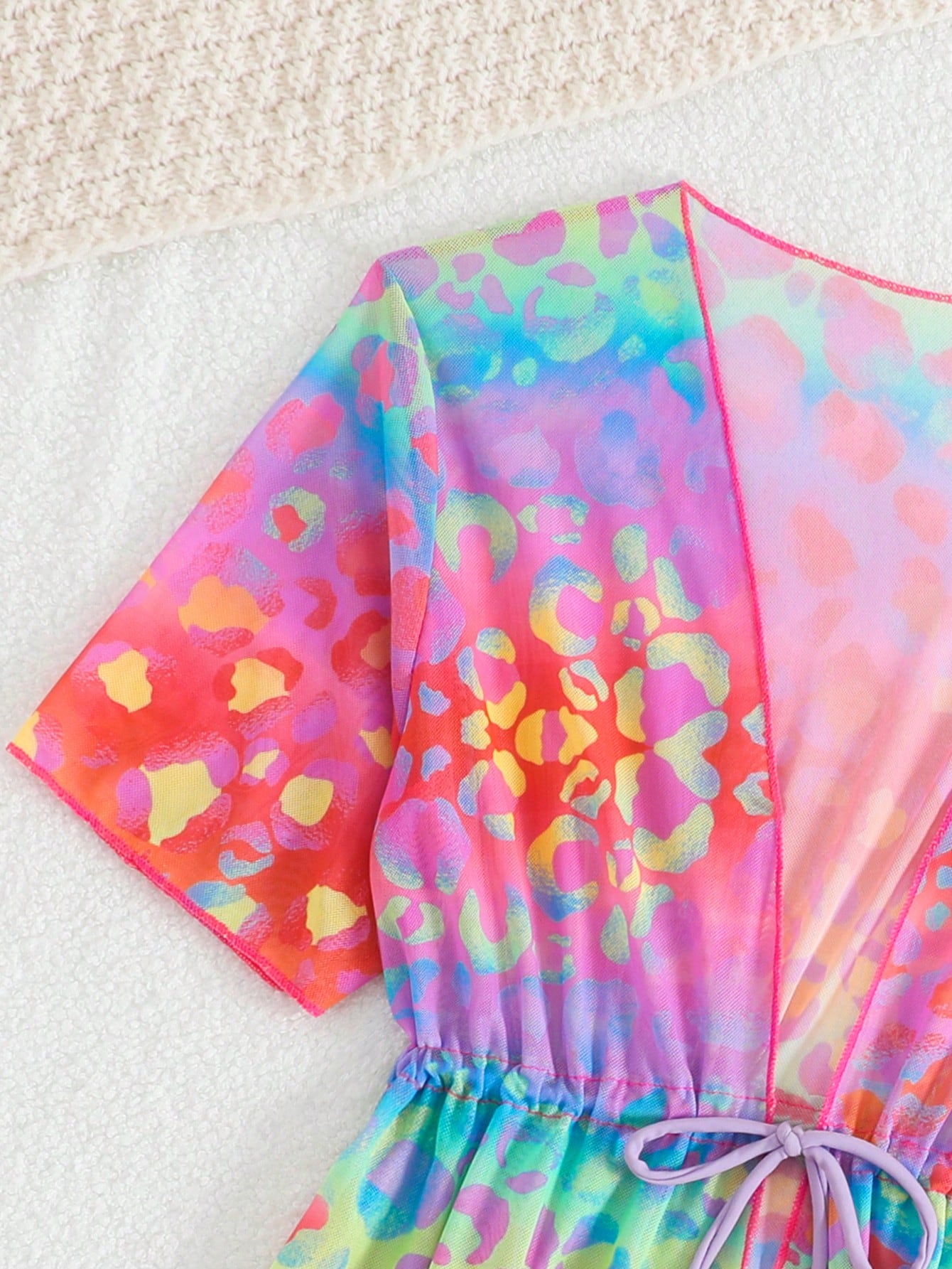 Tween girls multicolor 2-piece swimsuit set with scoop neck, cut-out details, patterned design, shorts-style bottoms, and sheer UV protection cover-up for beach and pool vacations.