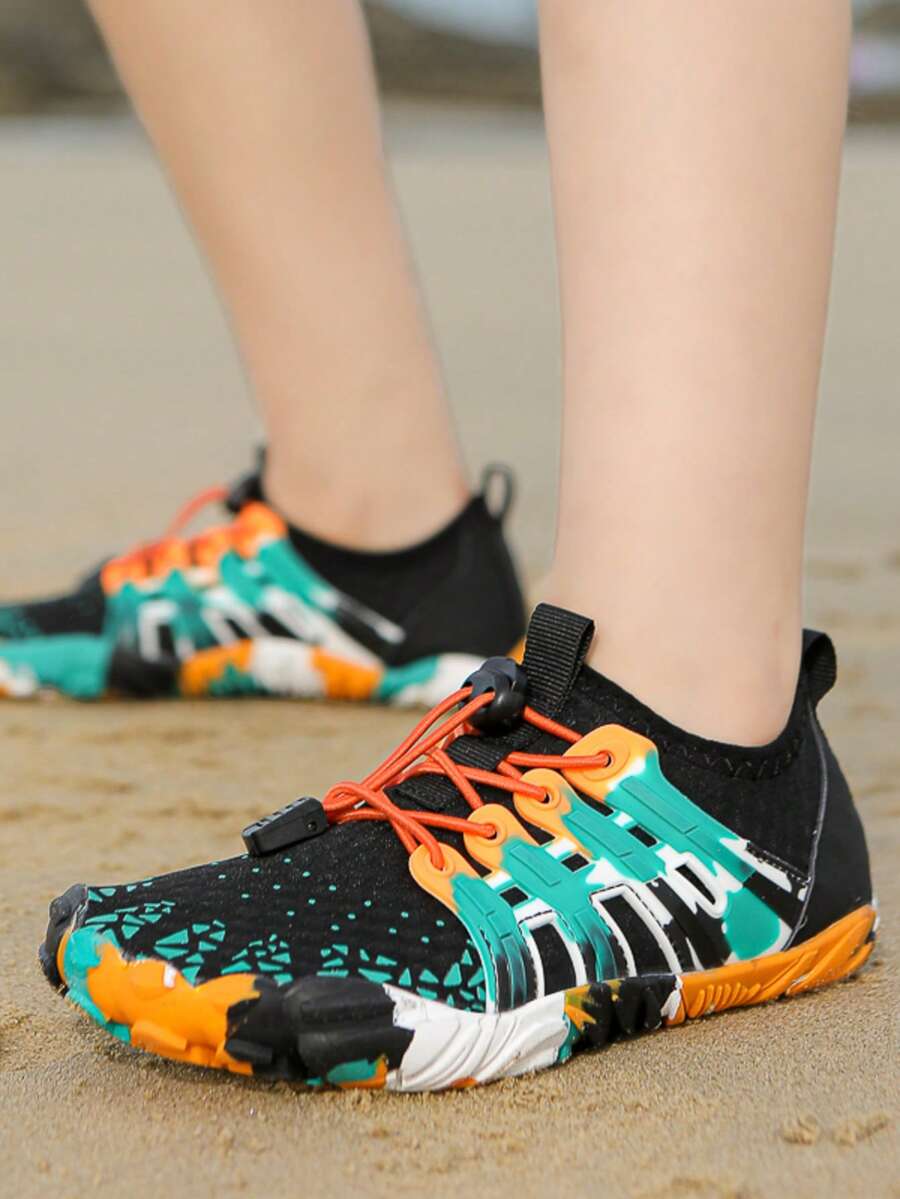 Apricot children's water shoes featuring slip-on fabric uppers, drawstring details, and rubber soles for beach play.
