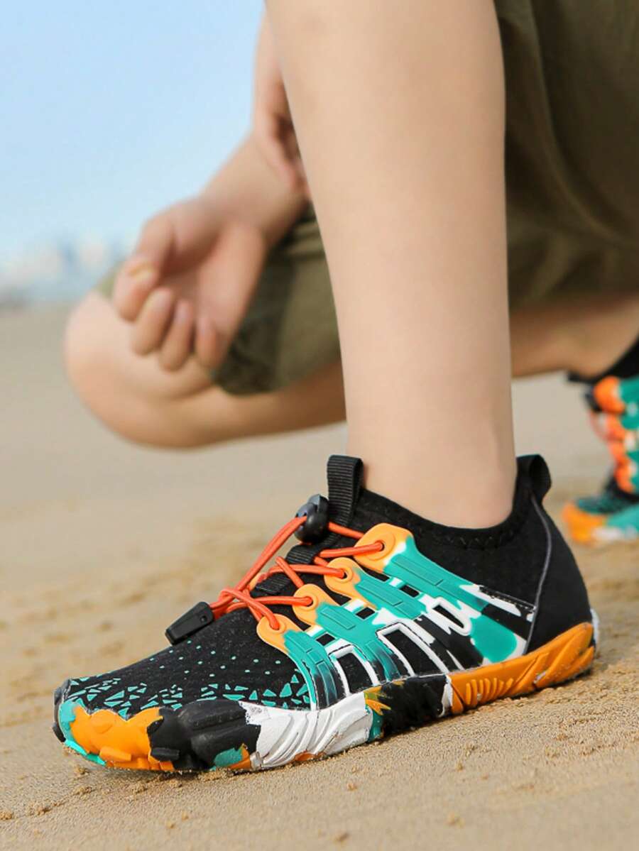 Apricot children's water shoes featuring slip-on fabric uppers, drawstring details, and rubber soles for beach play.
