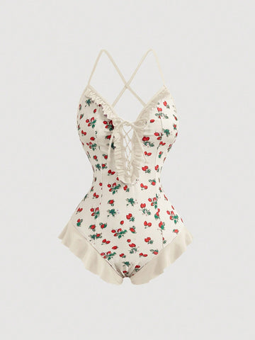 Women's strawberry print one-piece swimsuit featuring ruffle details, front-tie design, backless criss-cross straps, and triangle wireless cups.