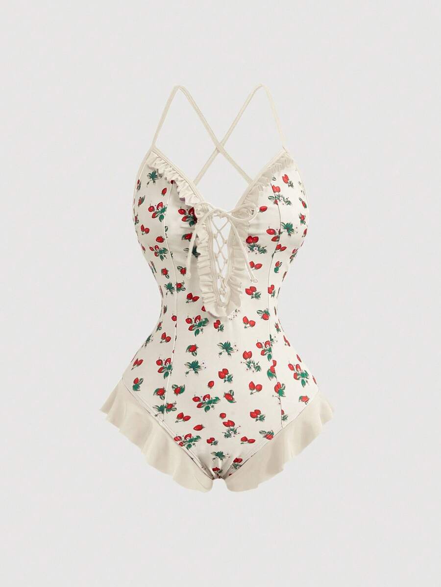 Women's strawberry print one-piece swimsuit featuring ruffle details, front-tie design, backless criss-cross straps, and triangle wireless cups.
