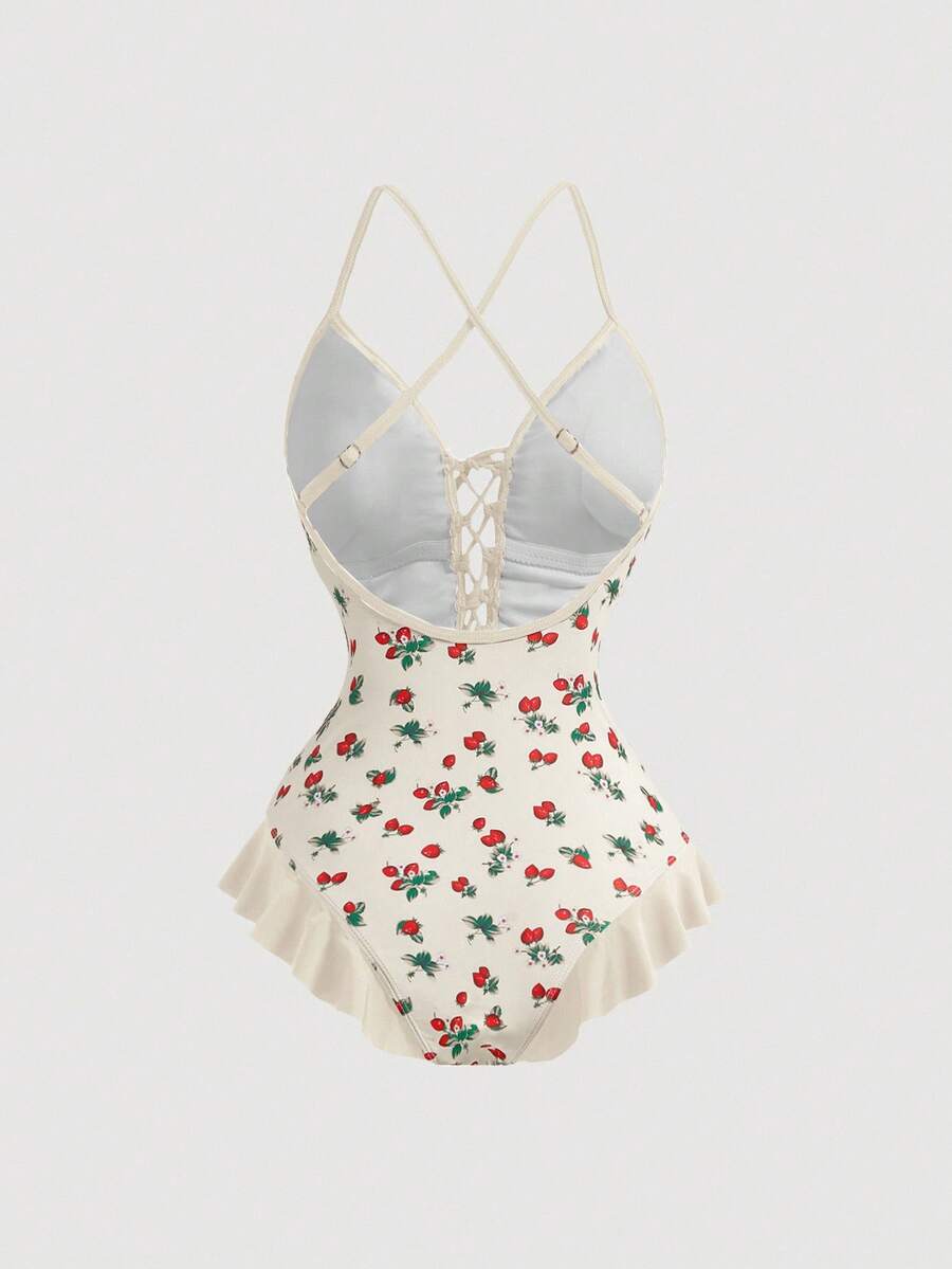 Women's strawberry print one-piece swimsuit featuring ruffle details, front-tie design, backless criss-cross straps, and triangle wireless cups.