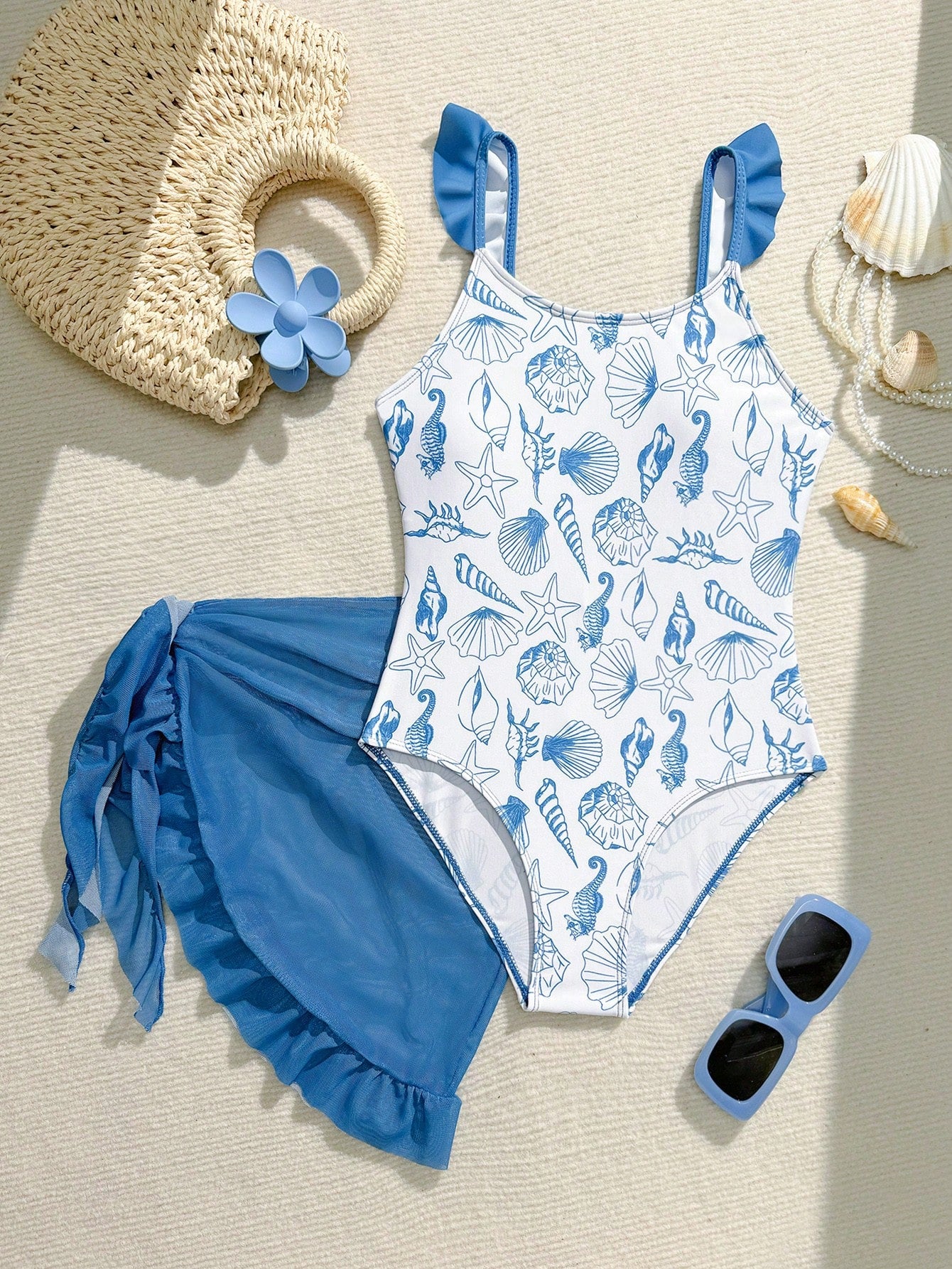 Tween girls one-piece swimsuit in leopard print with ruffle shoulder straps, scoop neckline, fitted shape, and attached ruffle hem skirt; sleeveless, mid-waist skirt bottom, and lined body for swimming, vacation, and summer beach wear.