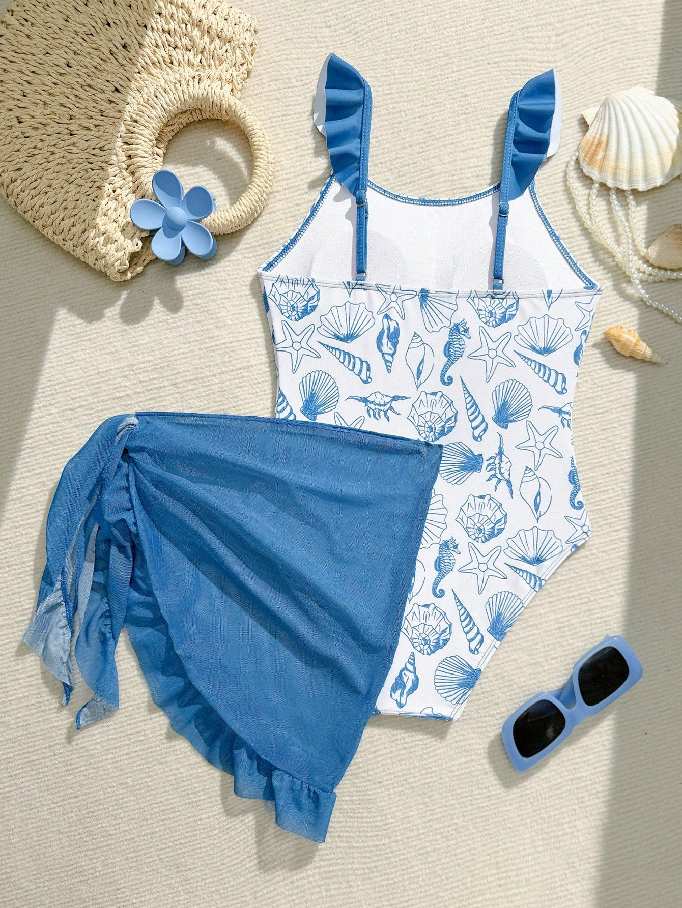 Tween girls one-piece swimsuit in leopard print with ruffle shoulder straps, scoop neckline, fitted shape, and attached ruffle hem skirt; sleeveless, mid-waist skirt bottom, and lined body for swimming, vacation, and summer beach wear.