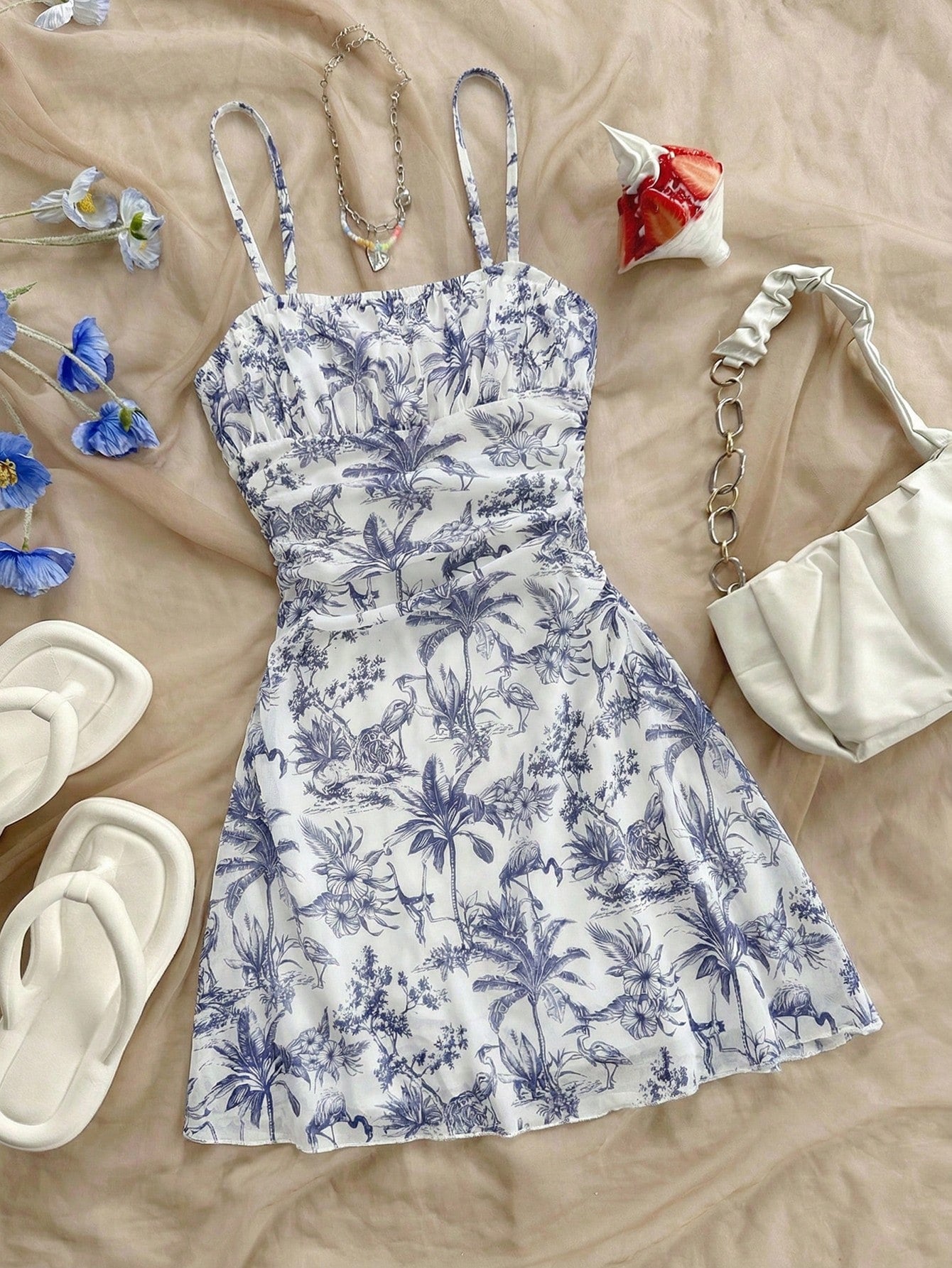Tween girl yellow mini sundress with large pink floral hibiscus print, spaghetti straps, high waist, flared hem, and sleeveless cami style for summer beach wear
