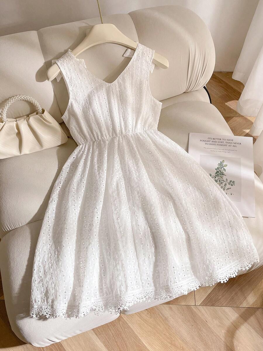 Girls sleeveless blue tiered dress featuring a V-neckline, high waist, and A-line skirt.