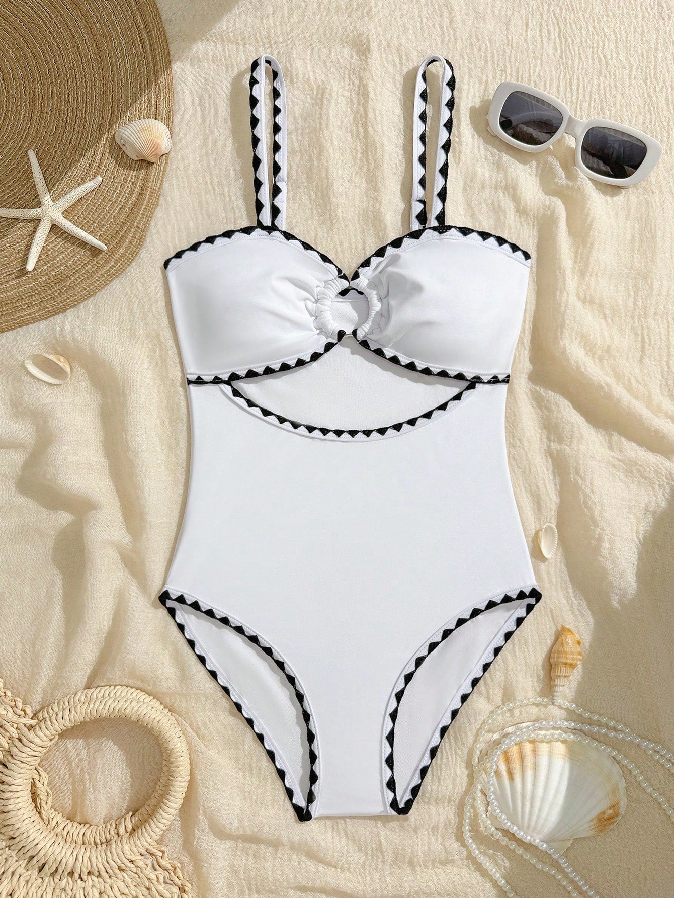 White one-piece swimsuit for tween girls with spaghetti straps, cut-out detail, plain design, and medium-stretch swimsuit fabric for beach, pool, and vacation wear.
