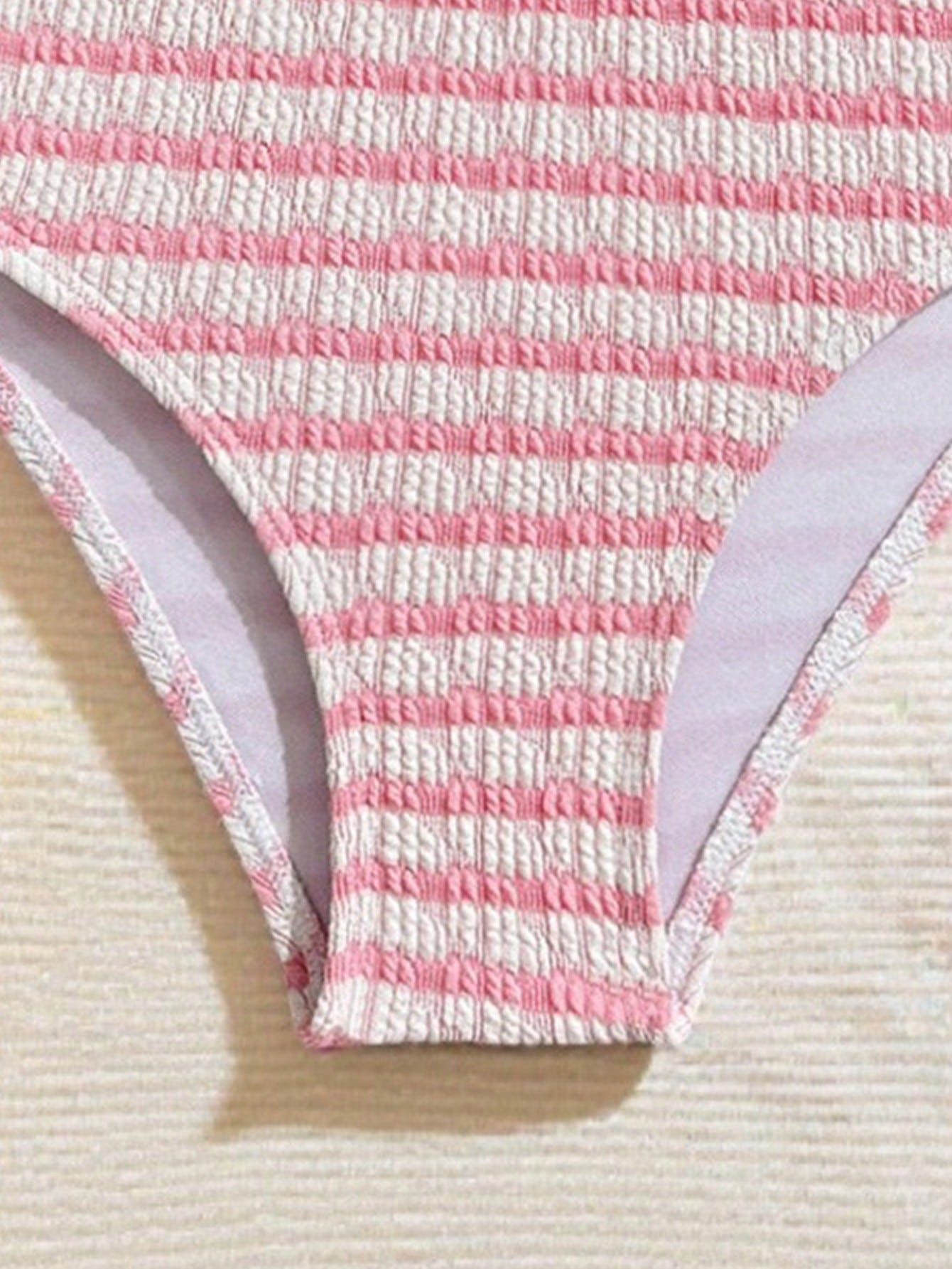 Tween girls blue and white striped two-piece bikini set with halter triangle top and mid-waist short bikini bottoms for beach and vacation swimwear.
