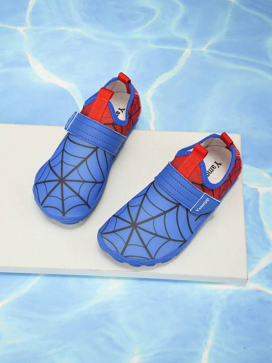 Pair of boys blue water shoes featuring a spider web mesh design, hook and loop strap, and non-slip rubber outsole.