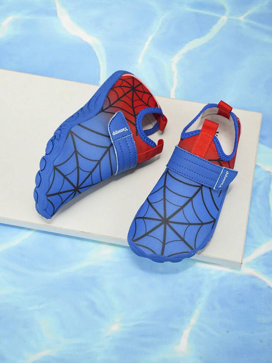 Pair of boys blue water shoes featuring a spider web mesh design, hook and loop strap, and non-slip rubber outsole.