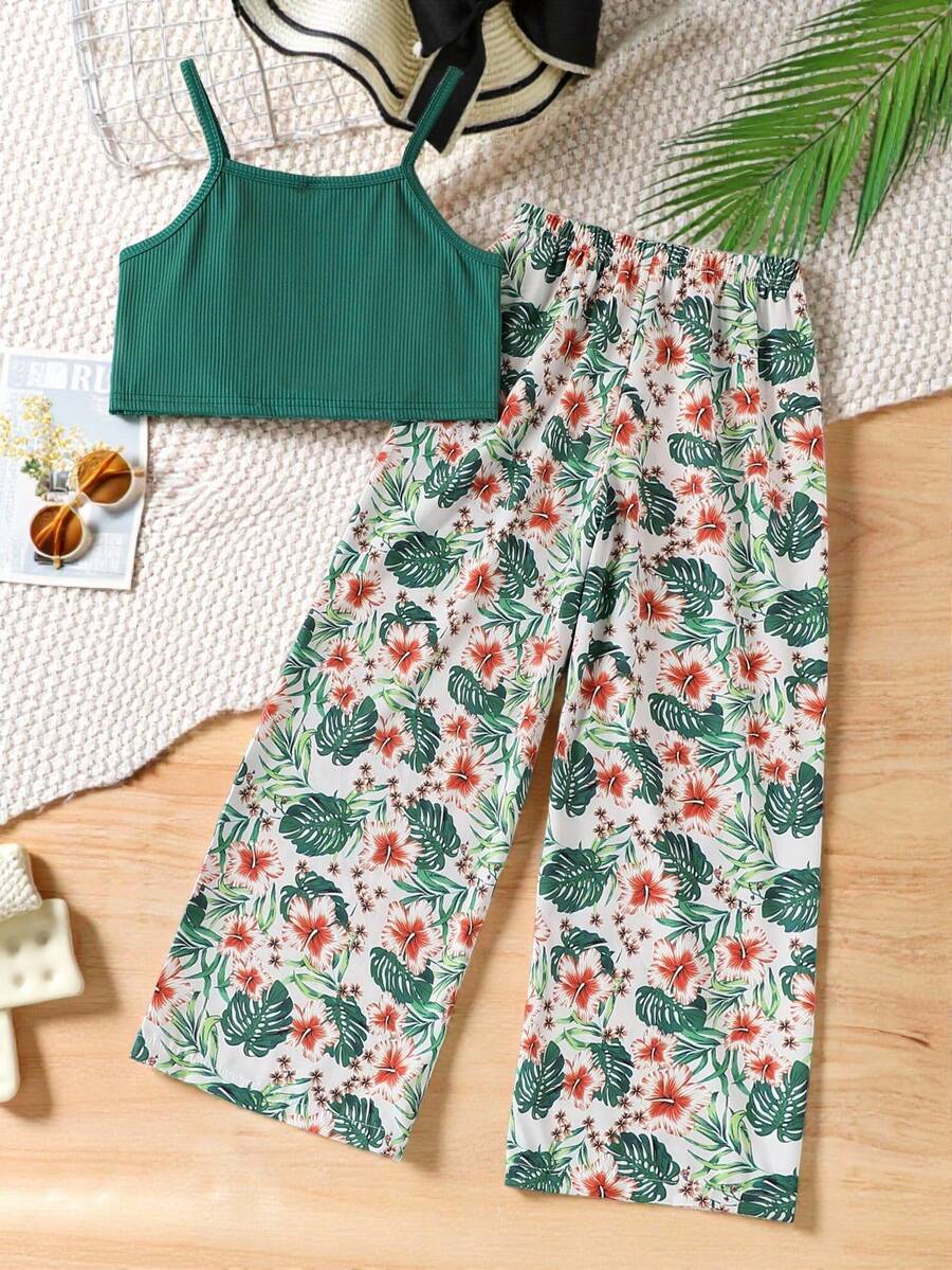 Tween girls blue 2-piece vacation outfit set featuring a tiered ruffle spaghetti strap camisole and loose high-waist pants.
