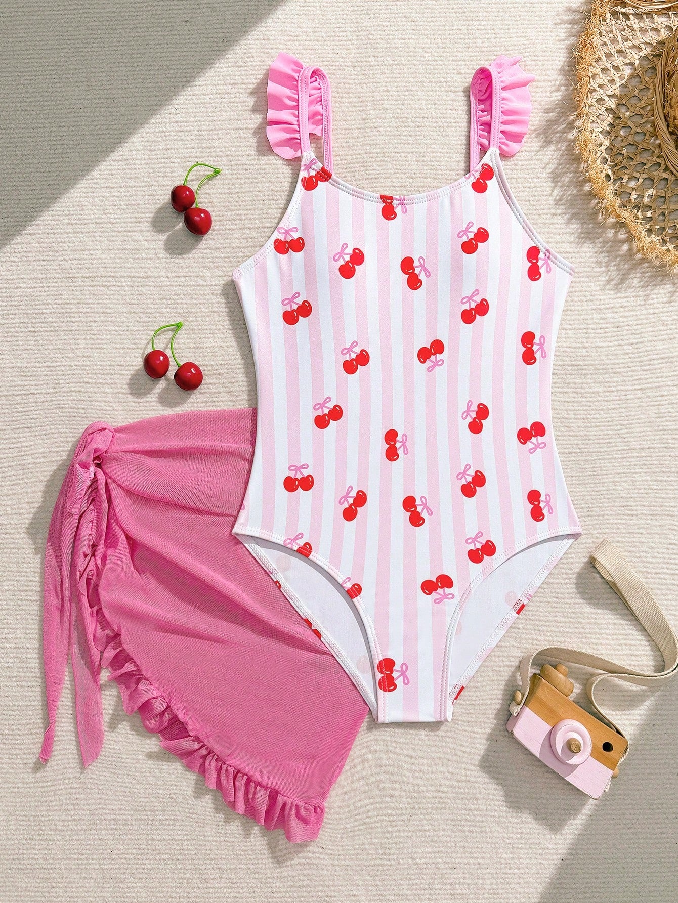 Tween girls one-piece swimsuit in leopard print with ruffle shoulder straps, scoop neckline, fitted shape, and attached ruffle hem skirt; sleeveless, mid-waist skirt bottom, and lined body for swimming, vacation, and summer beach wear.