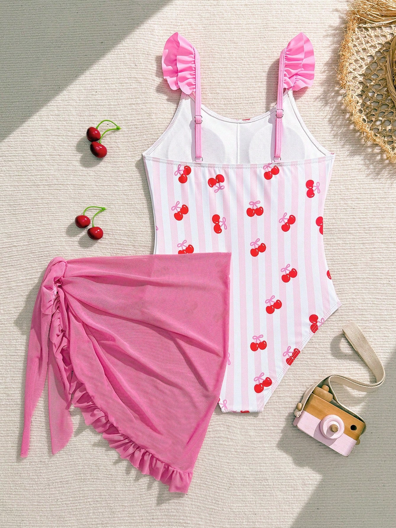 Tween girls one-piece swimsuit in leopard print with ruffle shoulder straps, scoop neckline, fitted shape, and attached ruffle hem skirt; sleeveless, mid-waist skirt bottom, and lined body for swimming, vacation, and summer beach wear.