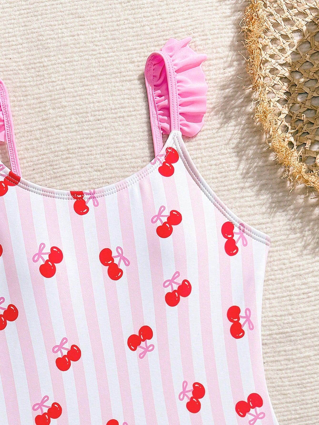 Tween girls one-piece swimsuit in leopard print with ruffle shoulder straps, scoop neckline, fitted shape, and attached ruffle hem skirt; sleeveless, mid-waist skirt bottom, and lined body for swimming, vacation, and summer beach wear.