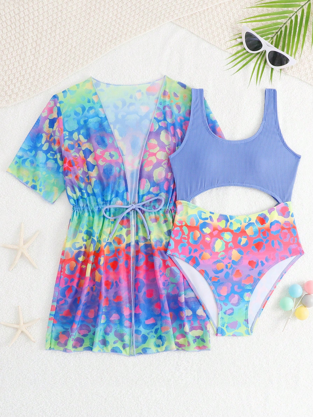 Tween girls multicolor 2-piece swimsuit set with scoop neck, cut-out details, patterned design, shorts-style bottoms, and sheer UV protection cover-up for beach and pool vacations.