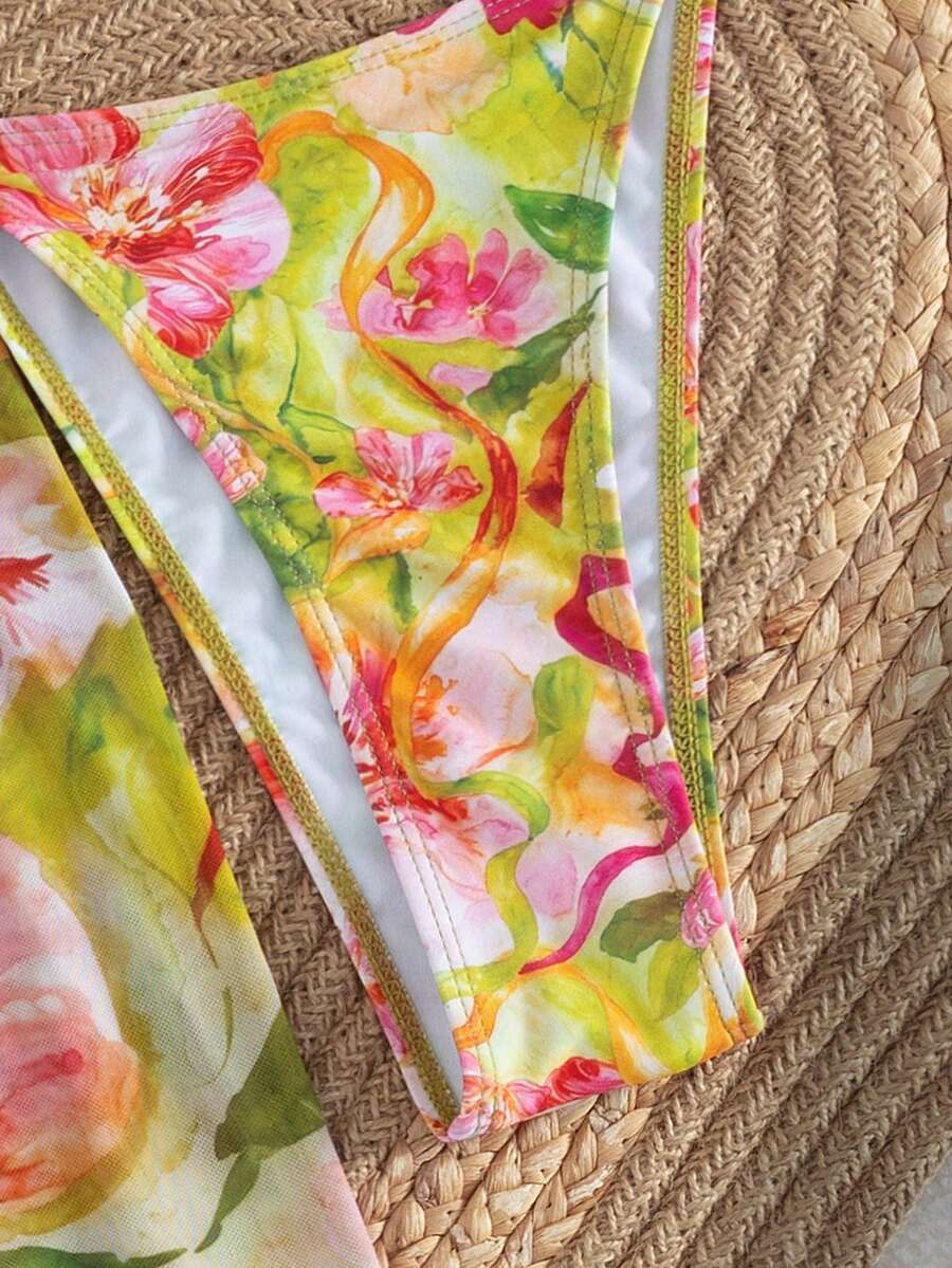 Women's 3-piece floral swimsuit set featuring a multicolor tie-back halter bikini top, low-waist bottoms, and a matching sheer mesh maxi skirt.