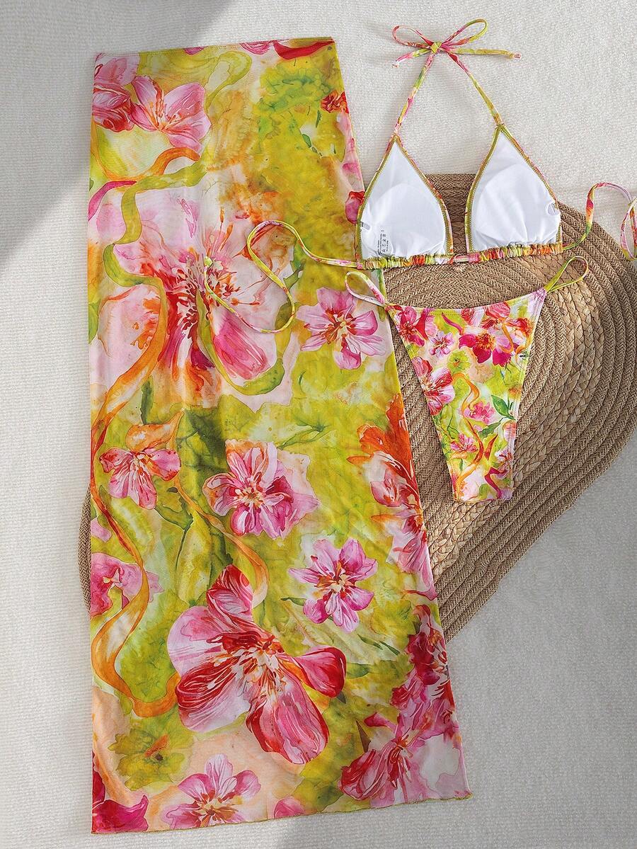 Women's 3-piece floral swimsuit set featuring a multicolor tie-back halter bikini top, low-waist bottoms, and a matching sheer mesh maxi skirt.