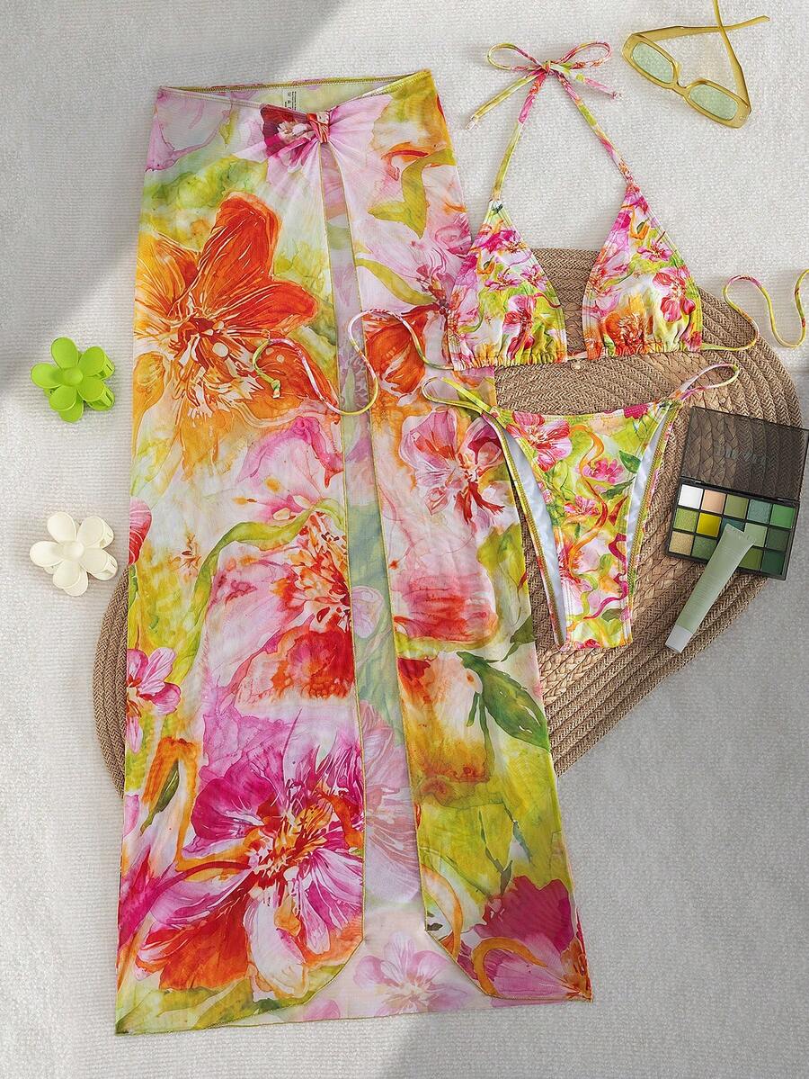Women's 3-piece floral swimsuit set featuring a multicolor tie-back halter bikini top, low-waist bottoms, and a matching sheer mesh maxi skirt.