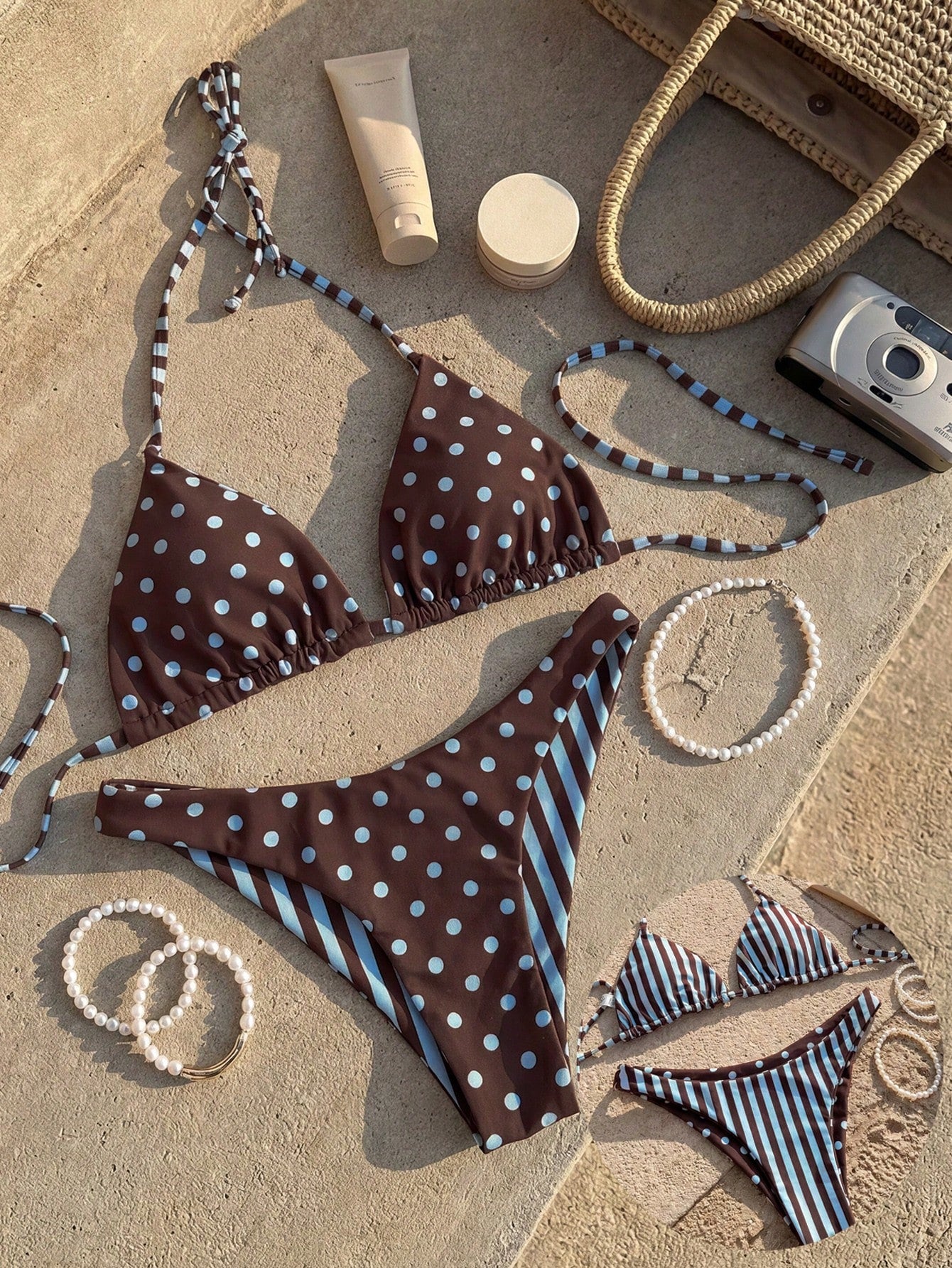 Women's two-piece halter bikini set featuring high cut thong bottoms and removable padding