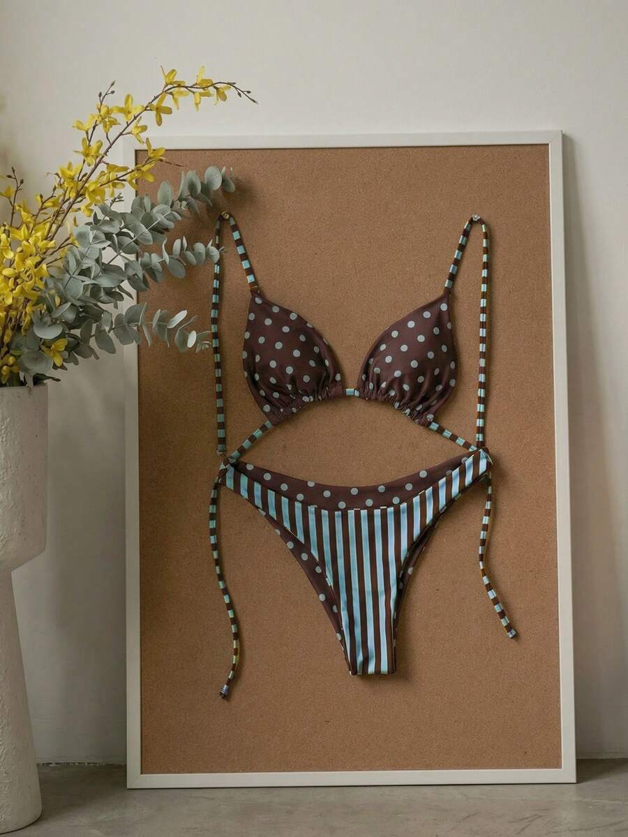 Women's two-piece halter bikini set featuring high cut thong bottoms and removable padding
