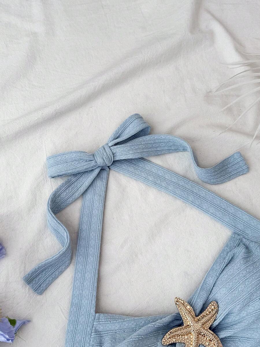 Tween girl summer dress in blue with striped pattern, halter neckline, tie front, sleeveless slim fit, high waist, and tiered ruffle hem for beach vacation and casual holiday wear.