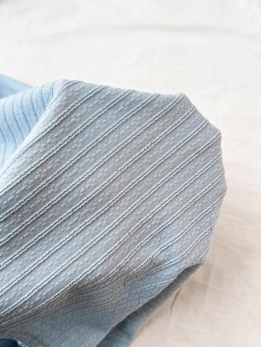 Tween girl summer dress in blue with striped pattern, halter neckline, tie front, sleeveless slim fit, high waist, and tiered ruffle hem for beach vacation and casual holiday wear.