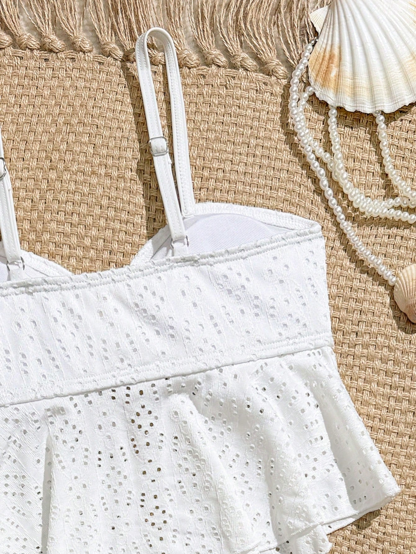 Tween girls two-piece tankini swimwear set with spaghetti straps, asymmetrical design, and 3D rose detail. Features a plant-pattern top and mid-waist bottoms in stretchy fabric for beach or pool wear.