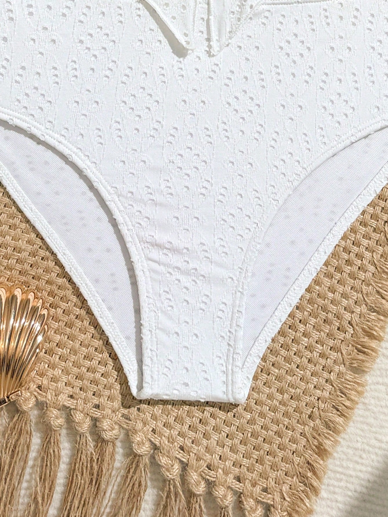 Tween girls 2-piece tankini swimwear set in apricot with a textured jacquard look, asymmetrical spaghetti-strap sleeveless top, and matching mid-waist short bikini bottoms.